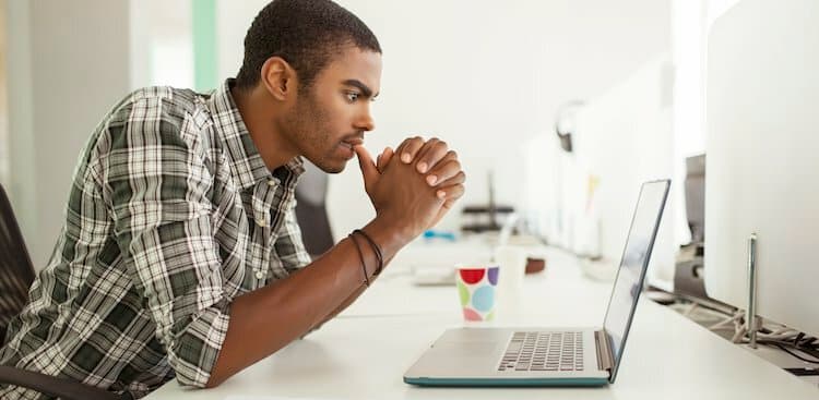 photo of man on laptop