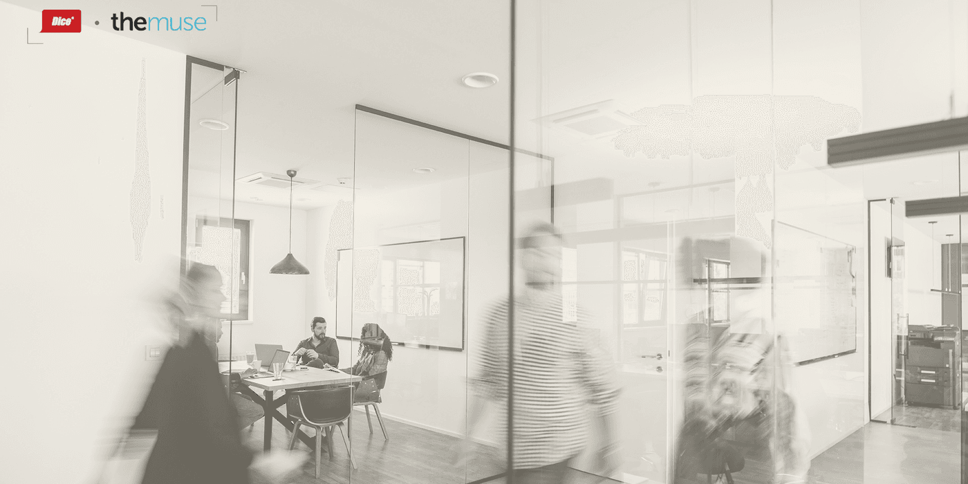 blurred images of people passing quickly in a hallway outside of a conference room in an office